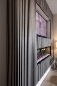Fitting acoustic wall panels